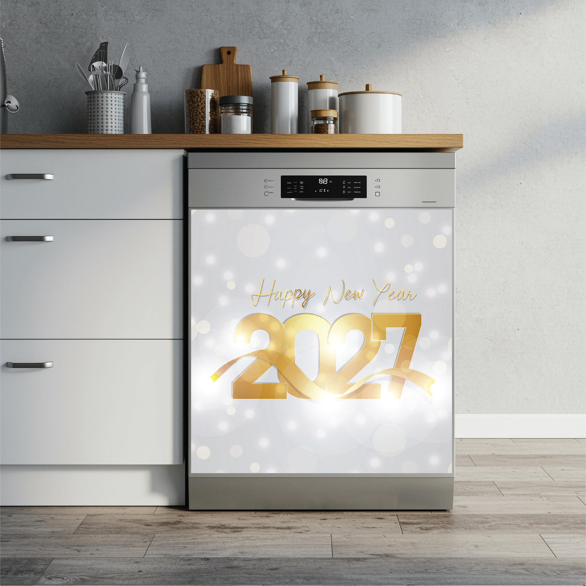 A stainless steel dishwasher in a modern kitchen setting, featuring a decorative 'Happy New Year 2027' dishwasher magnet on the door with a white bokeh background.