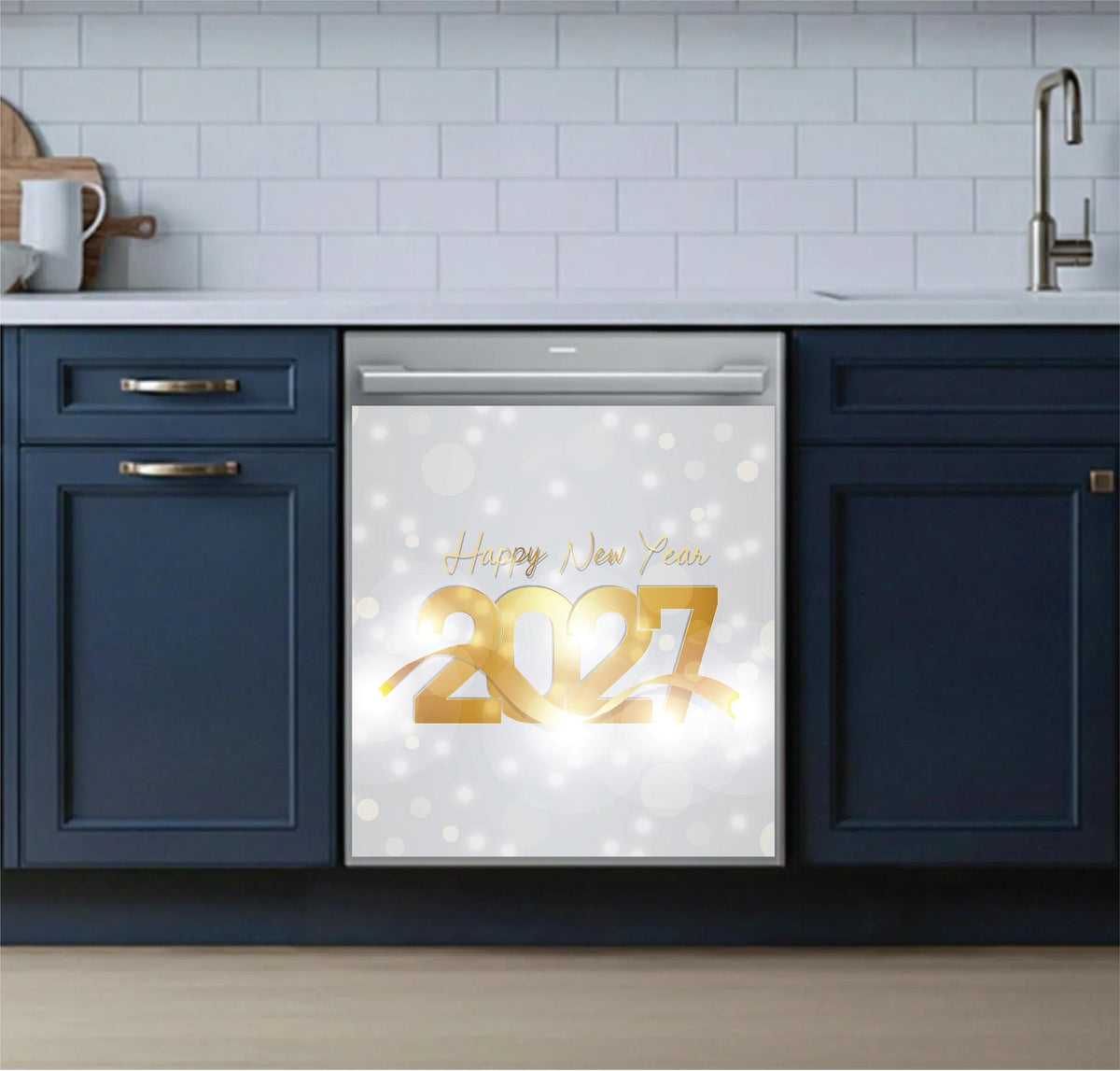 A stainless steel dishwasher in a modern kitchen setting, featuring a decorative 'Happy New Year 2027' dishwasher magnet on the door with a white bokeh background.