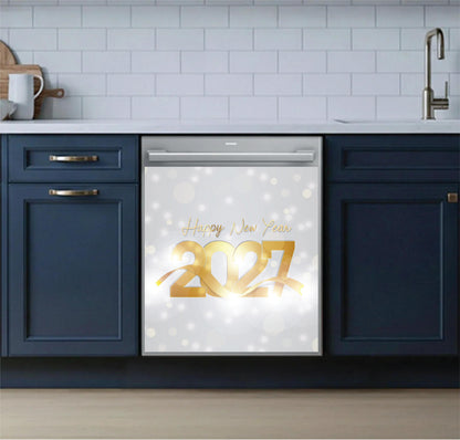 A stainless steel dishwasher in a modern kitchen setting, featuring a decorative 'Happy New Year 2027' dishwasher magnet on the door with a white bokeh background.