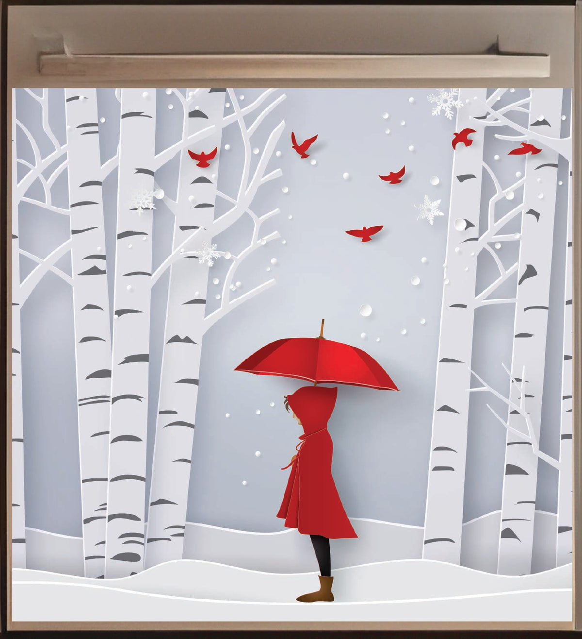 Dishwasher magnet with person in a red coat and umbrella standing in a snowy forest with red birds.