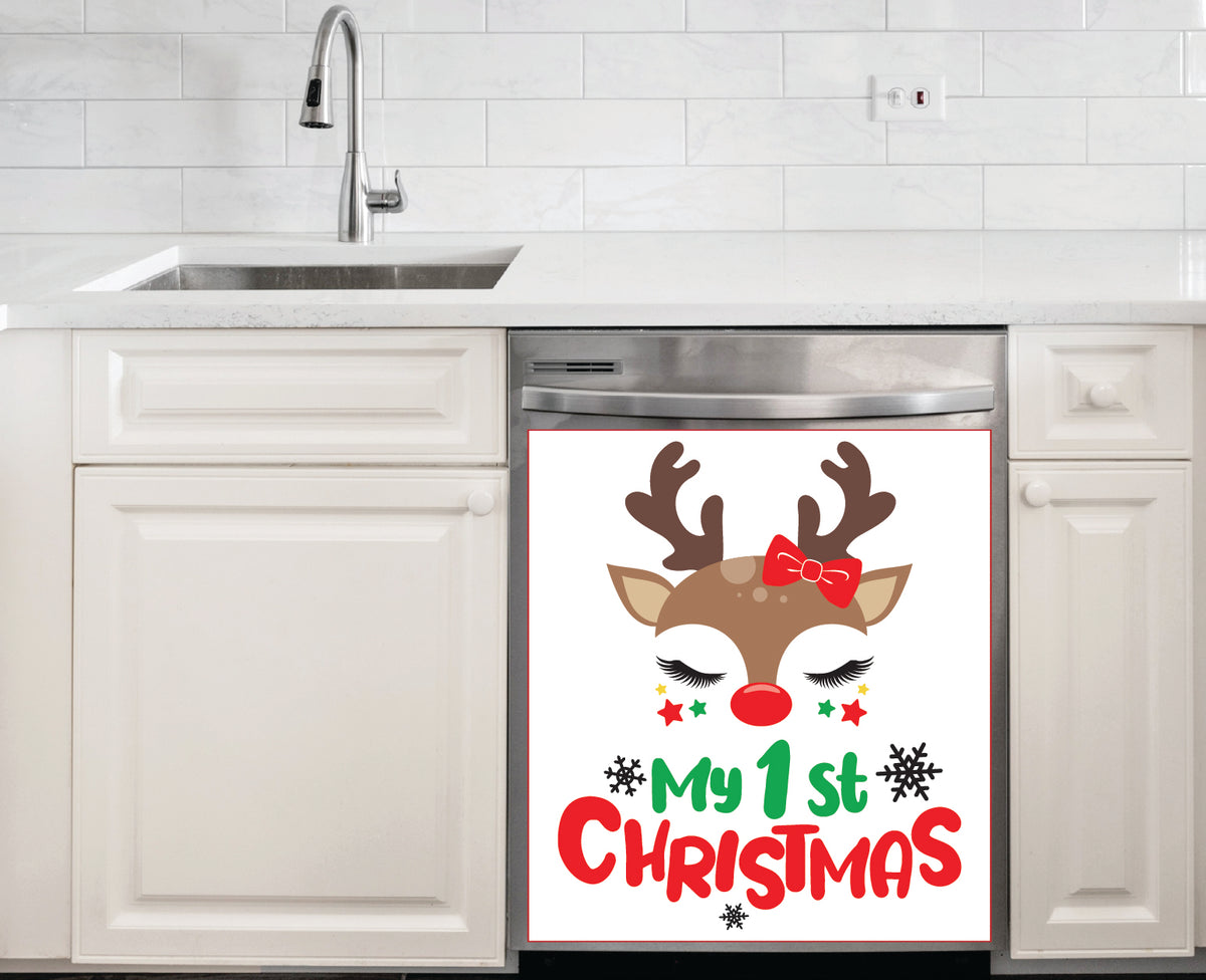 My 1st Christmas Girl Dishwasher Magnet featuring a cute girl reindeer with red bow, fluttery lashes, red nose, colorful stars, and bold holiday typography