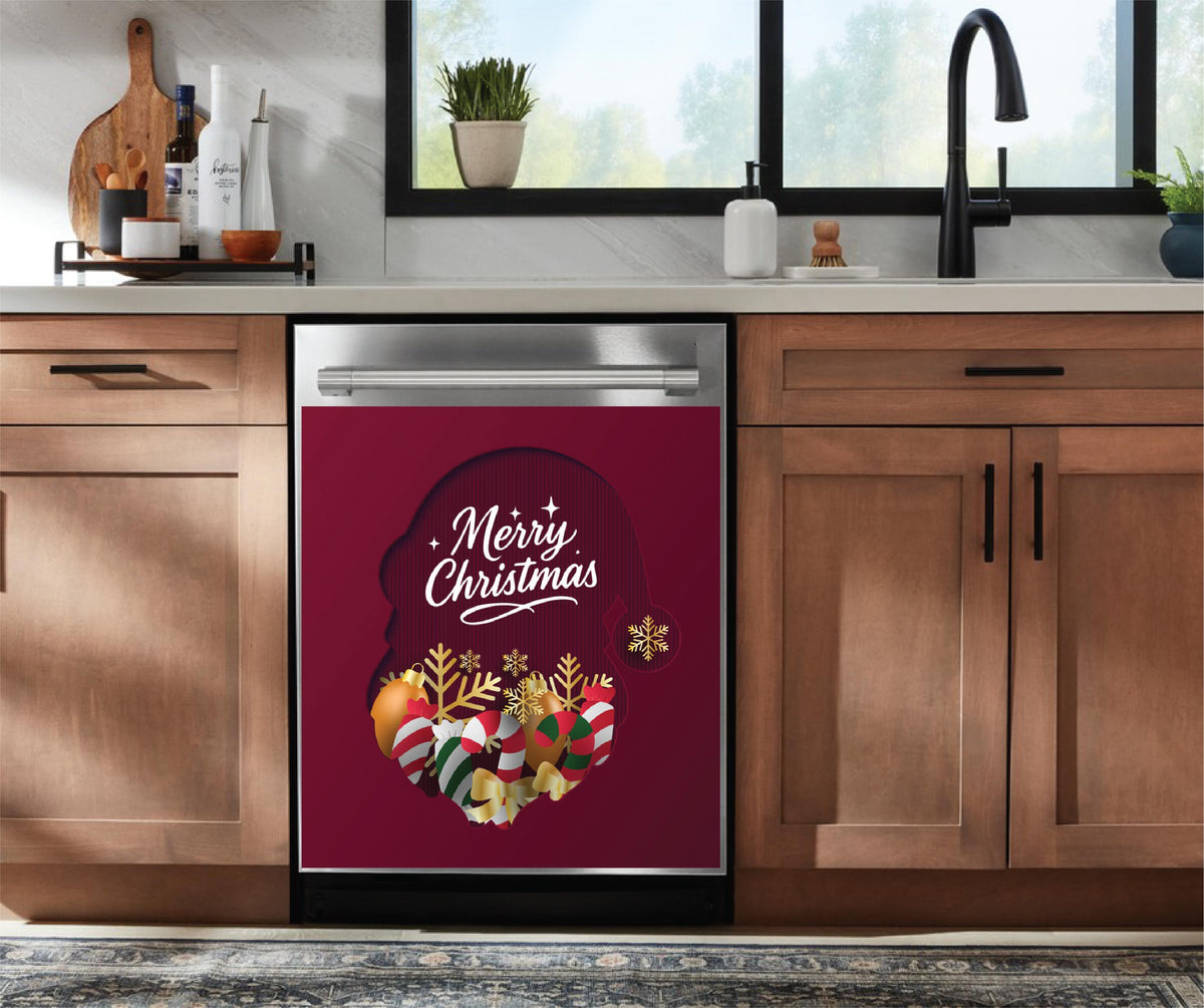 A stainless steel dishwasher installed in a kitchen, featuring a festive holiday  dishwasher magnet with a burgundy background, white 'Merry Christmas' script, and colorful Christmas ornaments and gold snowflakes.