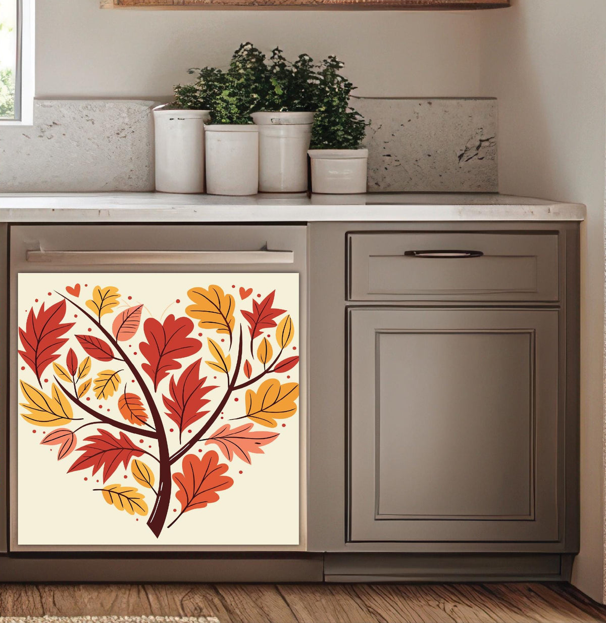 A dishwasher with a decorative dishwasher magnet autumn leaf tree design on the door, installed in a modern kitchen with dark blue cabinets and a white subway tile backsplash.